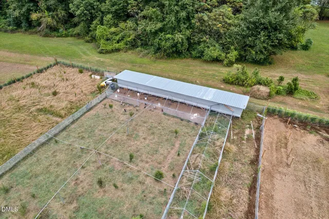 front view of a brick house with a yard