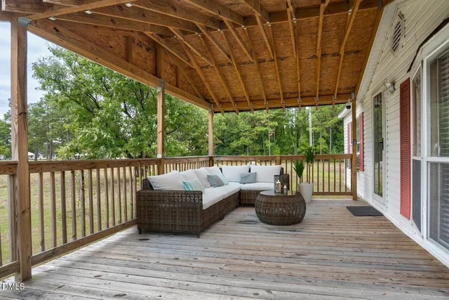 a house view with swimming pool and garden