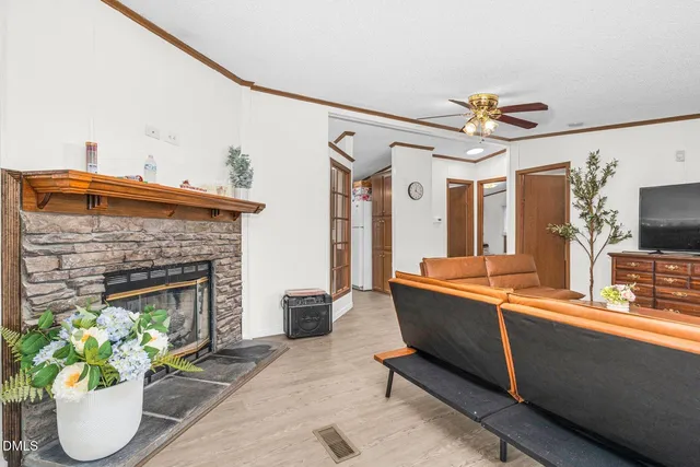a view of backyard with wooden floor and iron fence