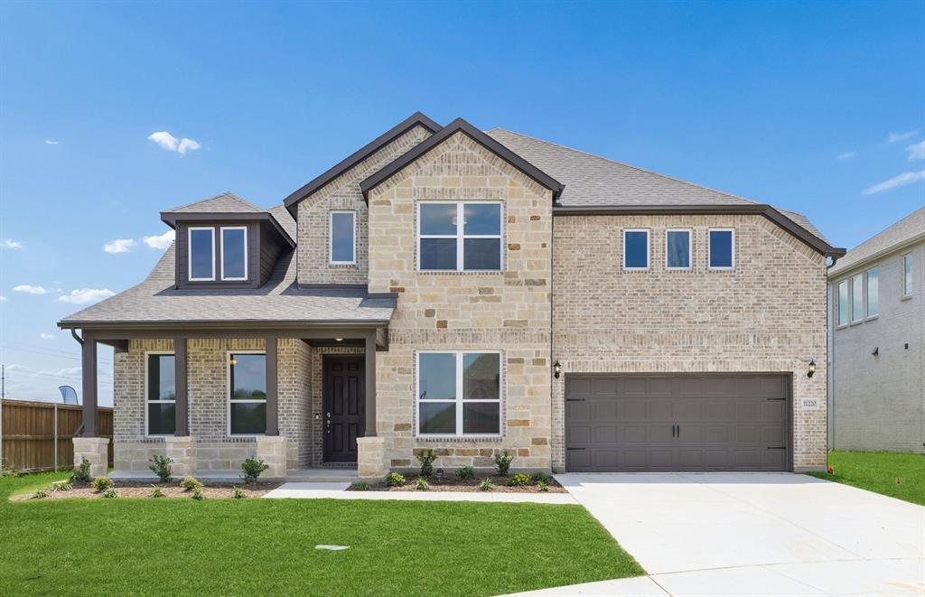11220 Abbotsbury Road Fort Worth, TX 76052 - Photo 1 of 32 a front view of a house with a yard