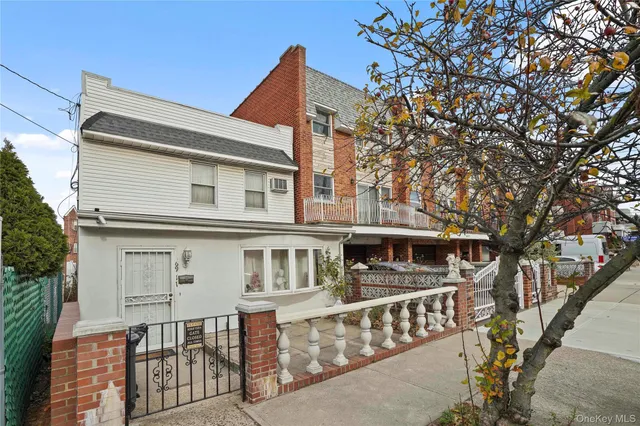 a front view of a house with large windows