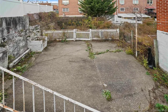 a view of a chairs and table on the side of the road