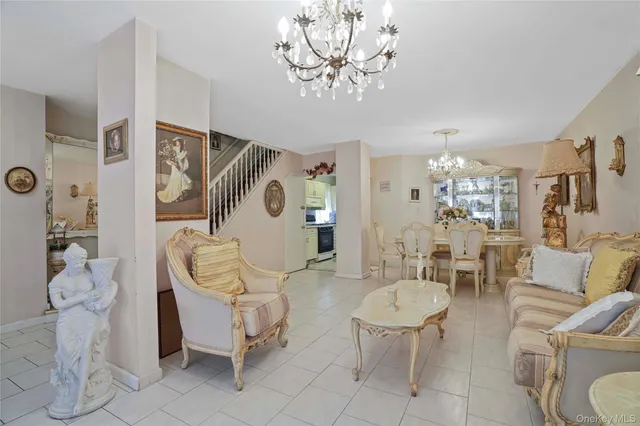 a living room with furniture a table and chairs