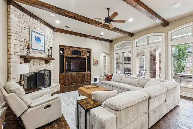 a living room with fireplace furniture and a flat screen tv
