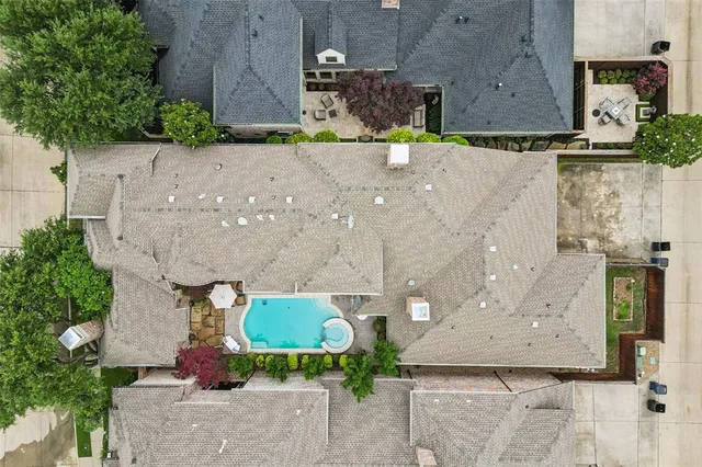 a living room with furniture a fireplace and a table