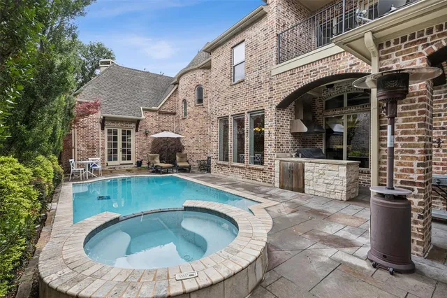 a swimming pool with outdoor seating