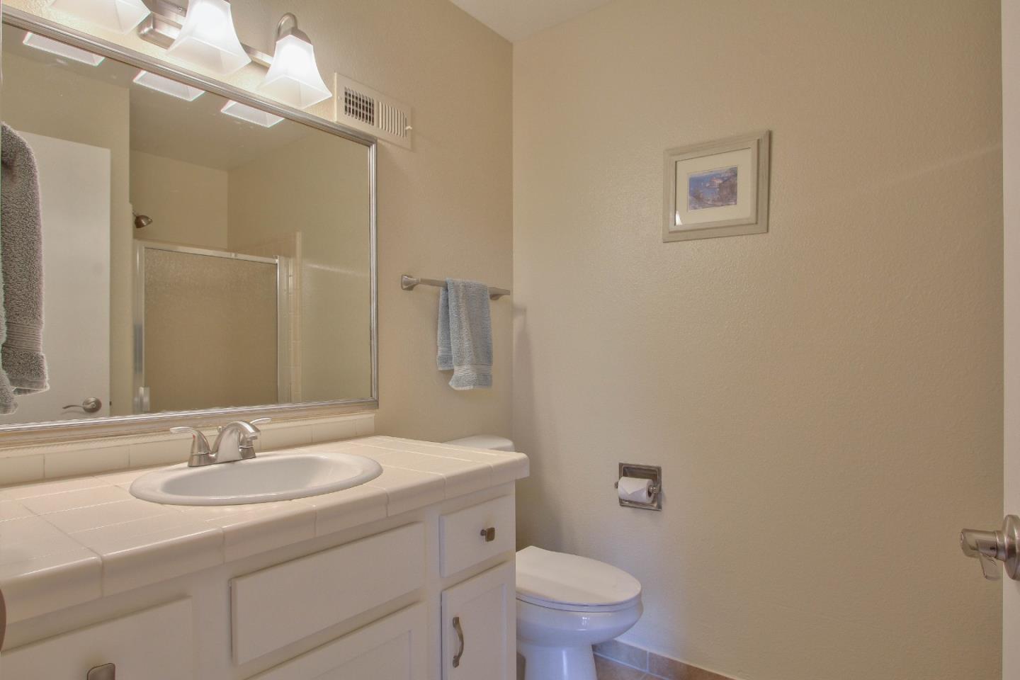 4000 Rio Road, Unit 26 Carmel, CA 93923 - Photo 19 of 27 a bathroom with a sink toilet and a mirror