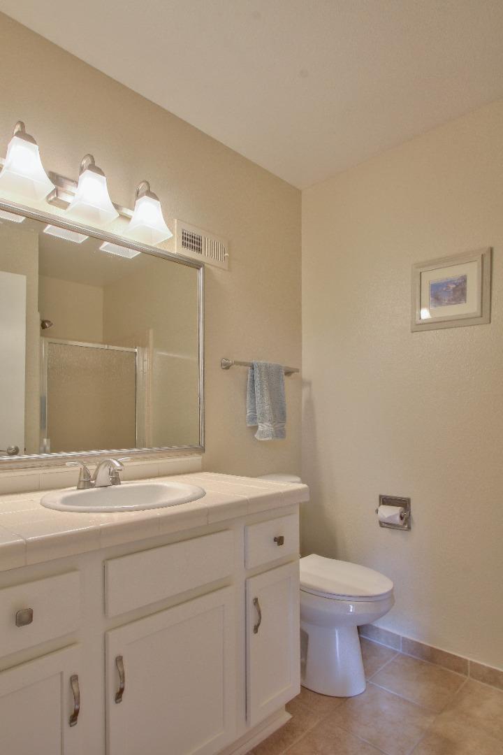 4000 Rio Road, Unit 26 Carmel, CA 93923 - Photo 20 of 27 a bathroom with a sink a toilet and mirror