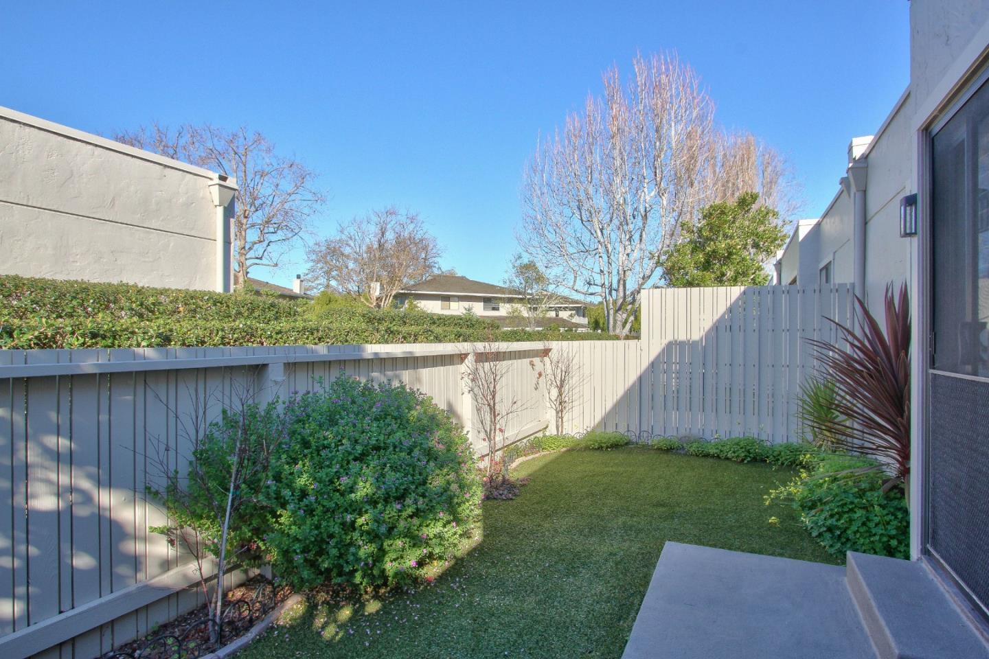 4000 Rio Road, Unit 26 Carmel, CA 93923 - Photo 24 of 27 a view of a backyard with plants and a lake view
