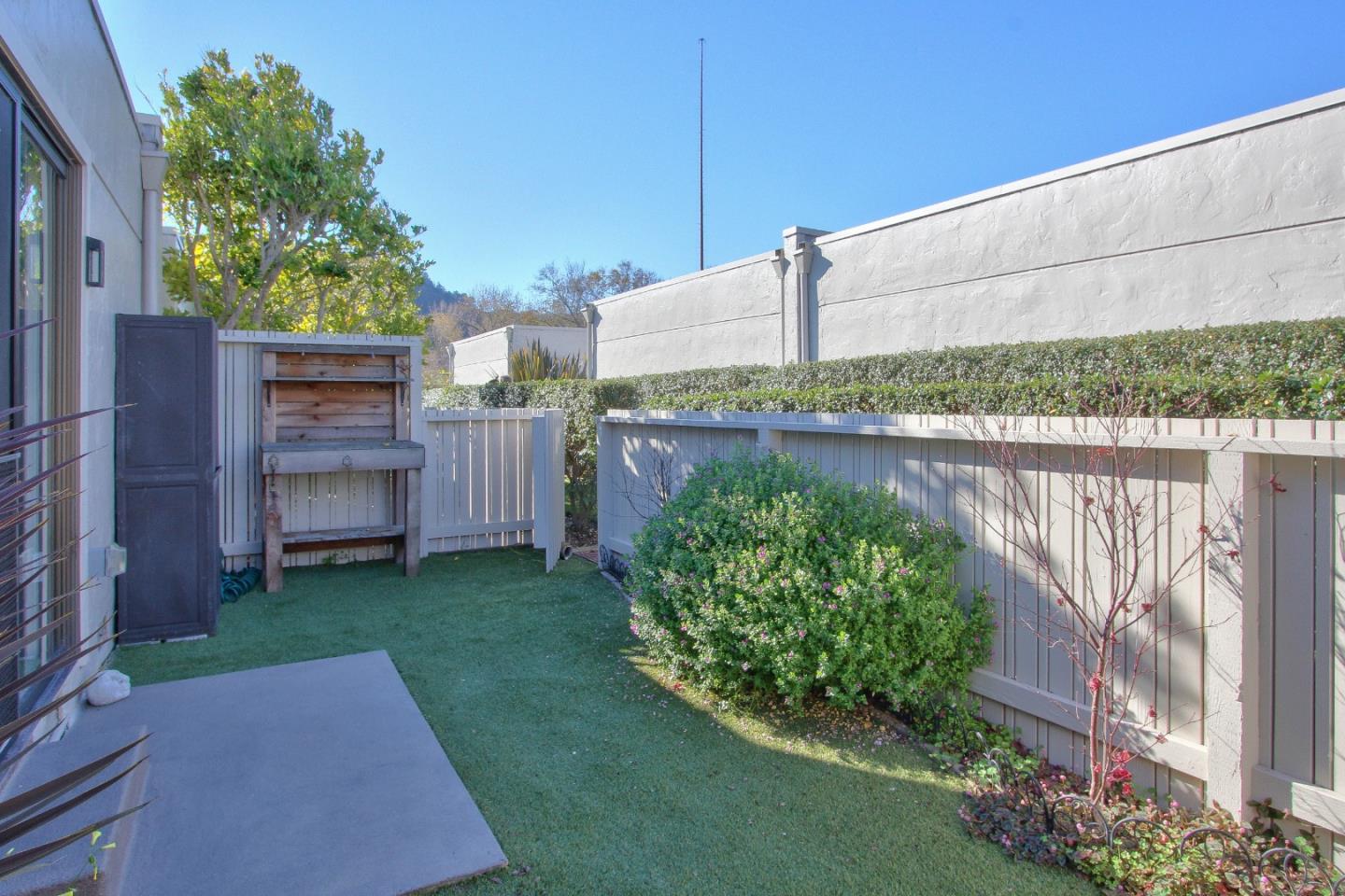 4000 Rio Road, Unit 26 Carmel, CA 93923 - Photo 25 of 27 a backyard of a house with lots of green space