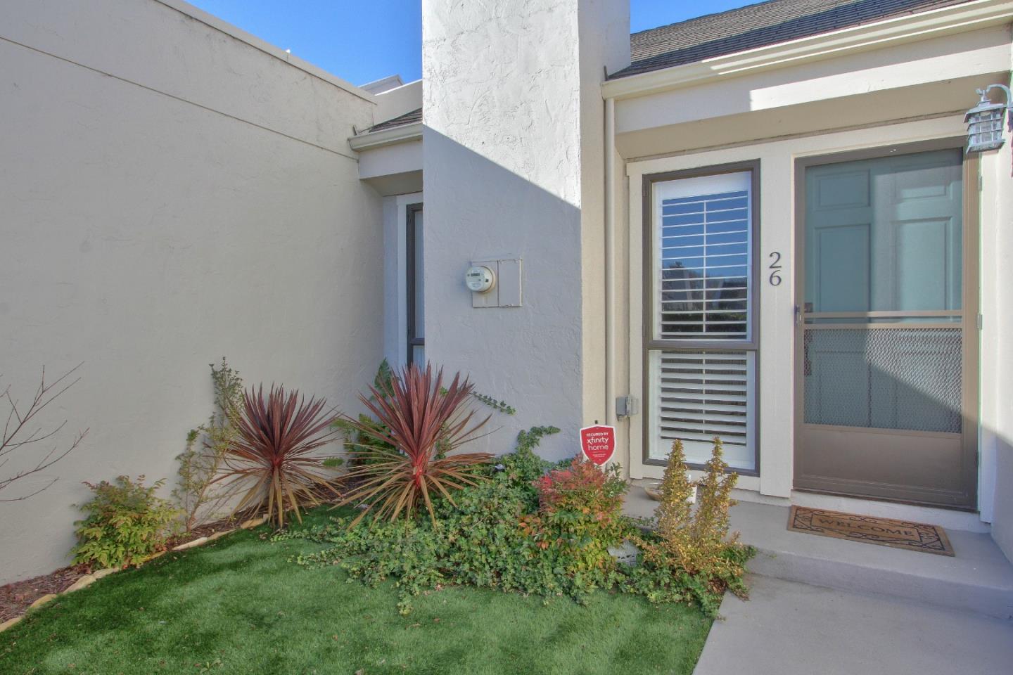 4000 Rio Road, Unit 26 Carmel, CA 93923 - Photo 3 of 27 a potted plant in front of a door