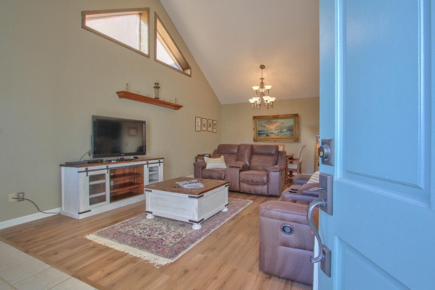 4000 Rio Road, Unit 26 Carmel, CA 93923 - Photo 5 of 27 a living room with furniture and a flat screen tv