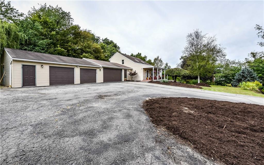 1064 Freedom Crider Road Freedom, PA 15042 - Photo 2 of 25 Front view showing 4 car garage and plenty of parking.