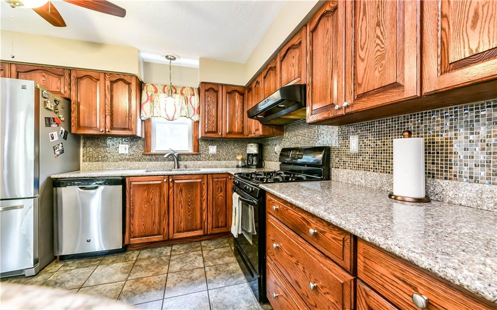 1064 Freedom Crider Road Freedom, PA 15042 - Photo 12 of 25 Kitchen showing Granite counter tops and Glass tile back splash