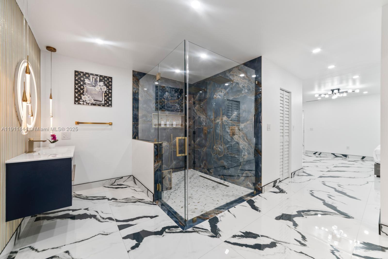 14242 Southwest 30th Street Miami, FL 33175 - Photo 25 of 45 a bathroom with a sink mirror and shower