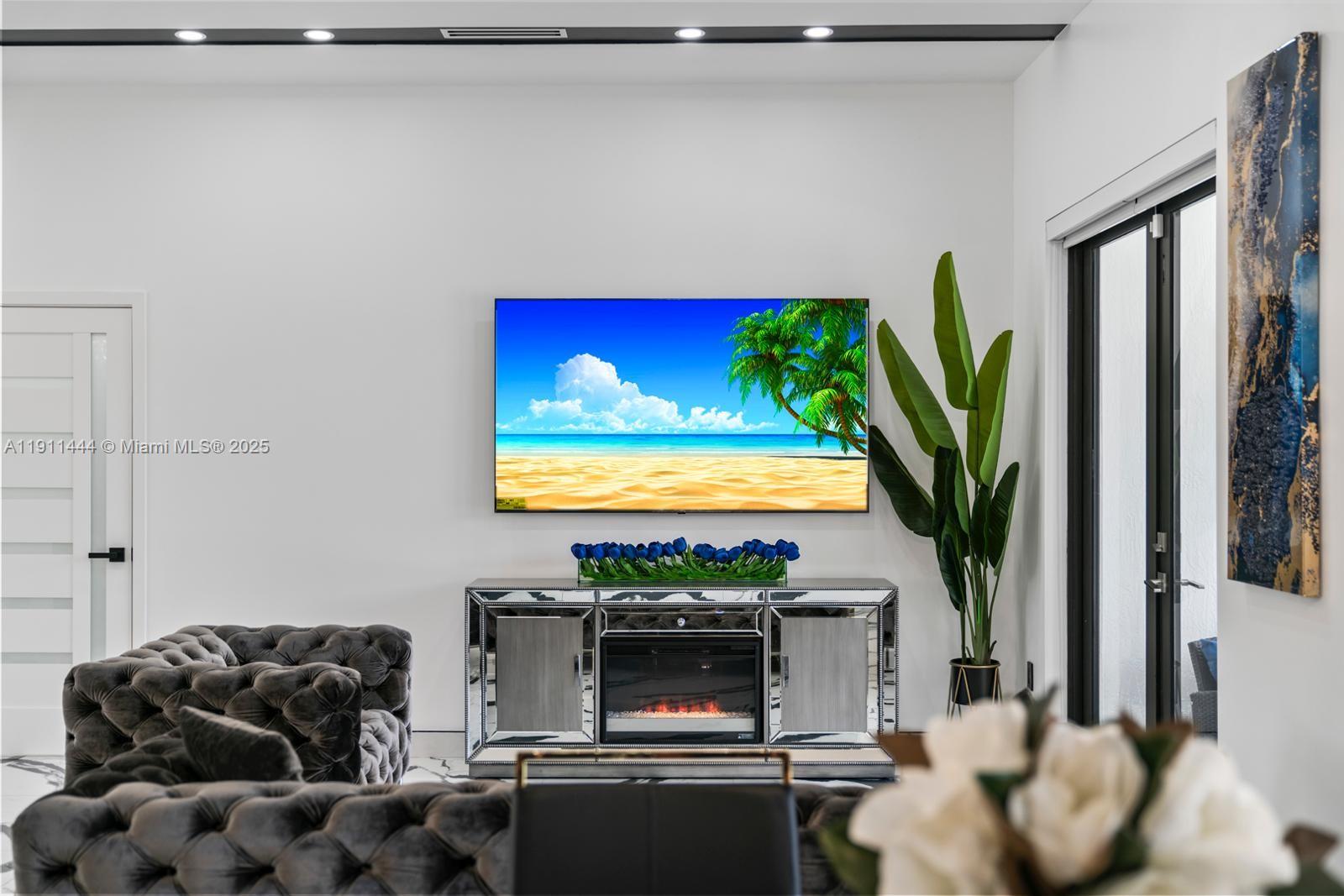 14242 Southwest 30th Street Miami, FL 33175 - Photo 44 of 45 a living room with furniture and a flat screen tv