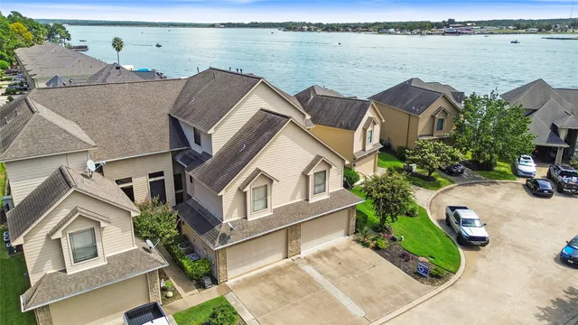 an aerial view of house with yard swimming pool and outdoor seating
