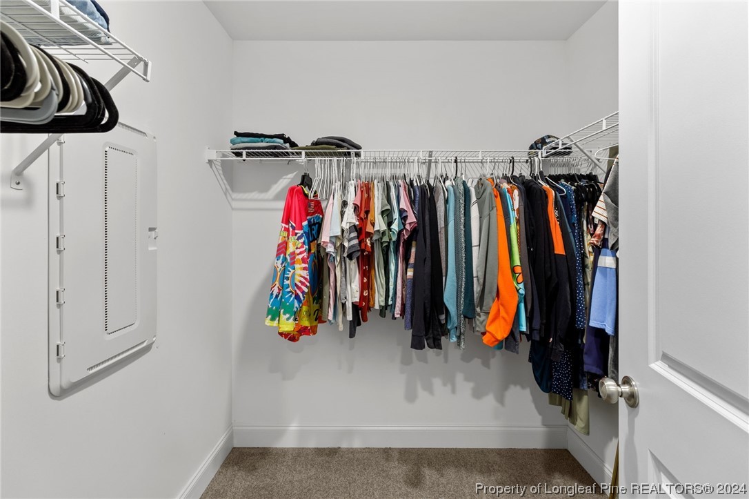 740 Walker Road Bunnlevel, NC 28323 - Photo 20 of 27 a view of walk in closet with clothes