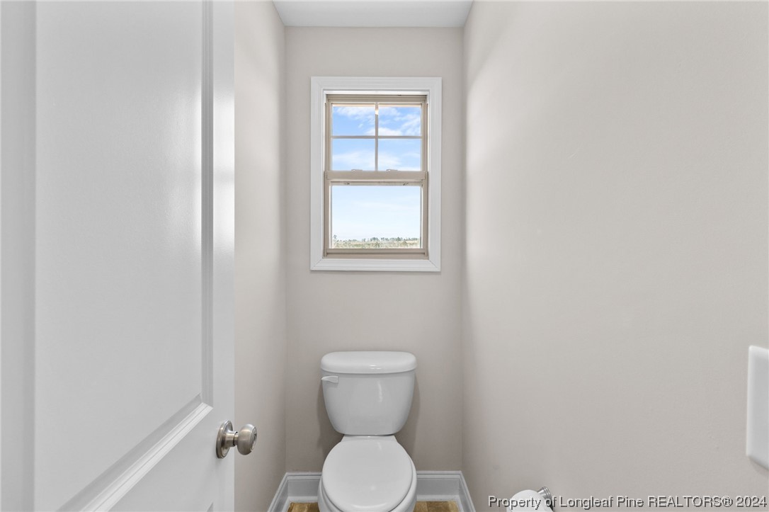 740 Walker Road Bunnlevel, NC 28323 - Photo 21 of 27 a bathroom with a toilet