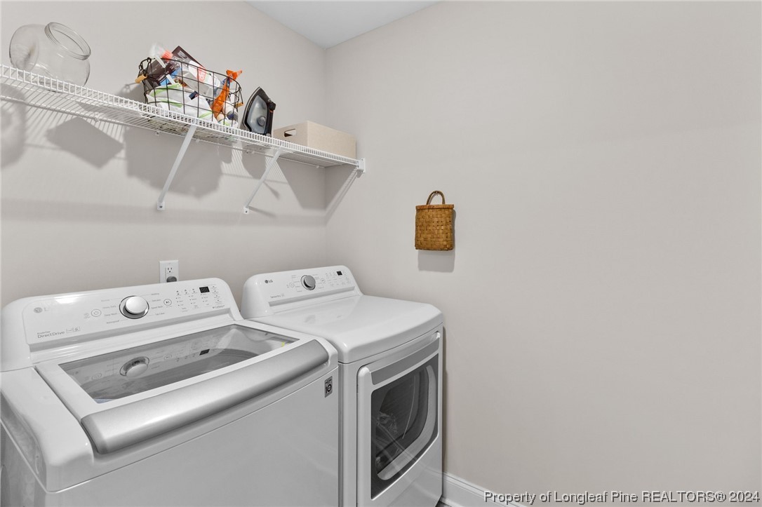 740 Walker Road Bunnlevel, NC 28323 - Photo 24 of 27 a utility room with dryer and washer