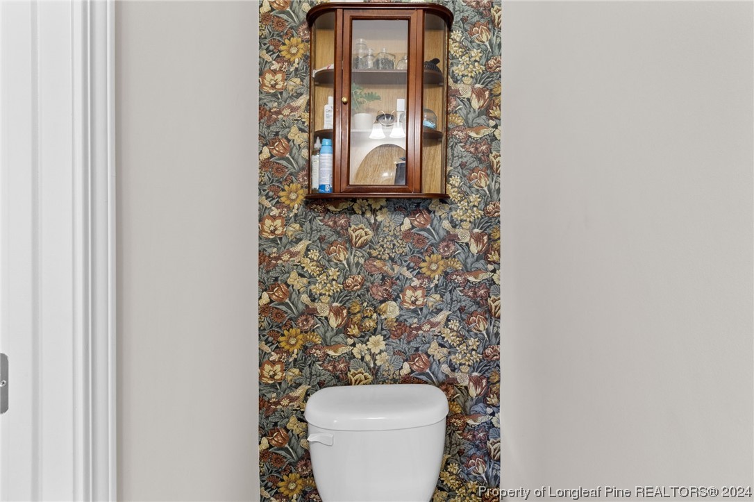 740 Walker Road Bunnlevel, NC 28323 - Photo 3 of 27 a room with a toilet and a sink