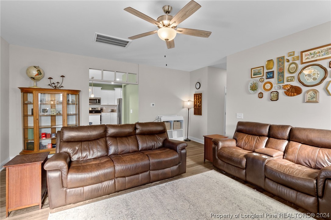 740 Walker Road Bunnlevel, NC 28323 - Photo 8 of 27 a living room with furniture and a couch