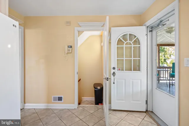 a view of a patio with a table chairs and a patio
