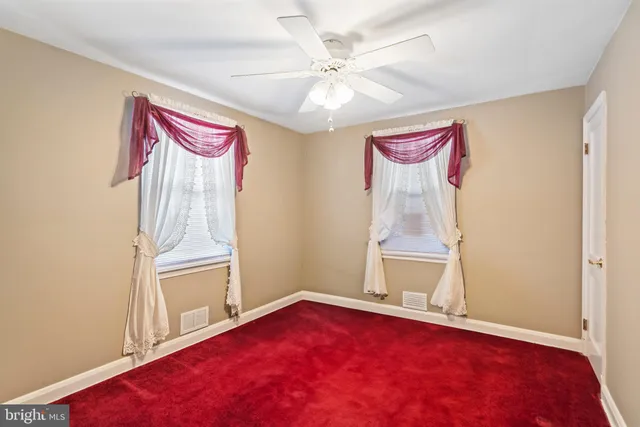 a view of an empty room and wooden floor