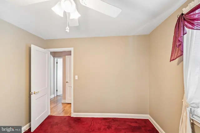 a view of a hallway with seating space