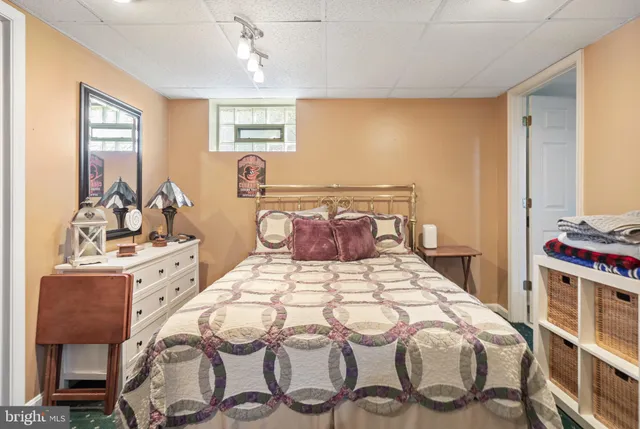 a bedroom with a bed and a couch