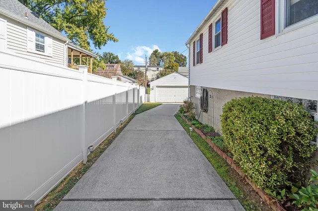 a view of a chairs and table in patio with a barbeque