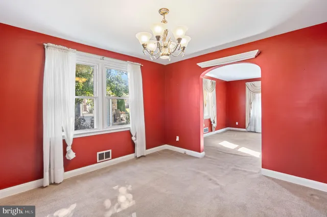 a kitchen with granite countertop a white stove top oven and cabinets