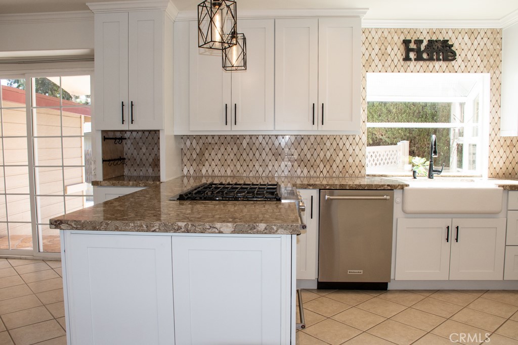 933 Eastside Road El Cajon, CA 92020 - Photo 17 of 70 a kitchen with a sink stove and cabinets