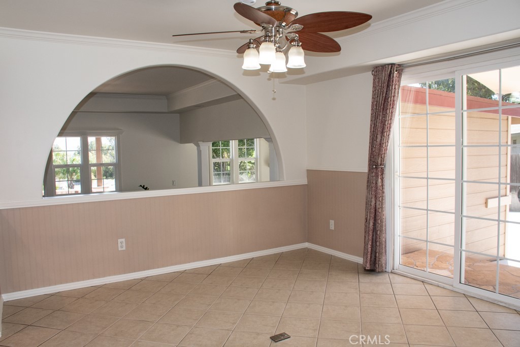 933 Eastside Road El Cajon, CA 92020 - Photo 21 of 70 an empty room with windows and chandelier fan