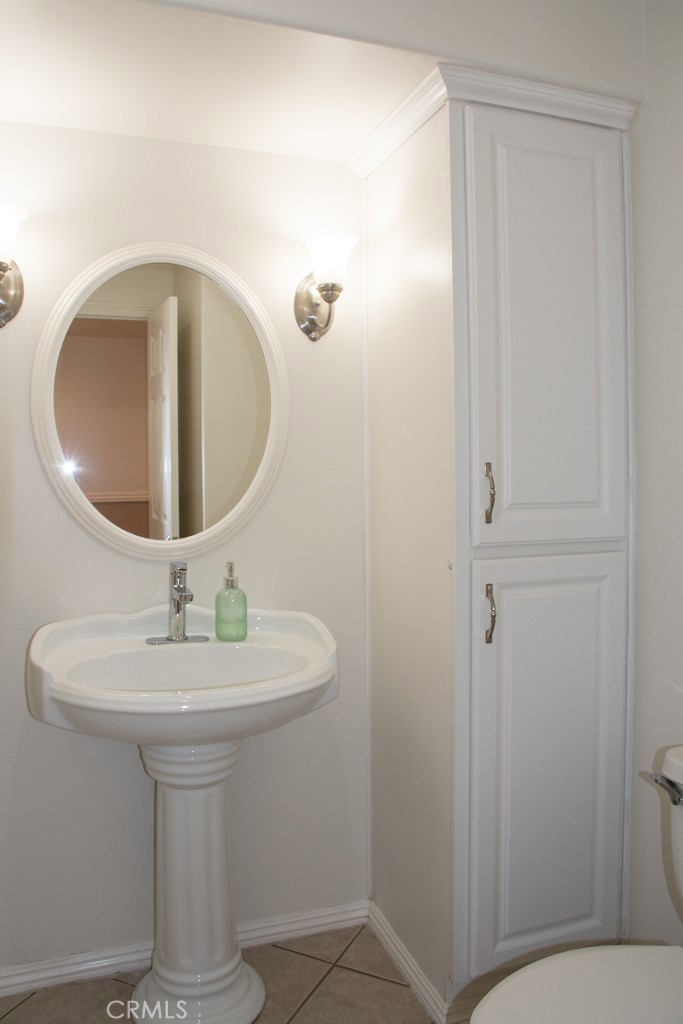 933 Eastside Road El Cajon, CA 92020 - Photo 22 of 70 a bathroom with a sink a mirror and vanity