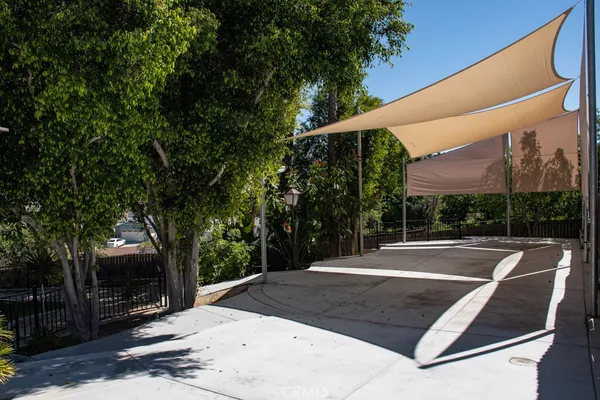 a view of a tree in front of a house