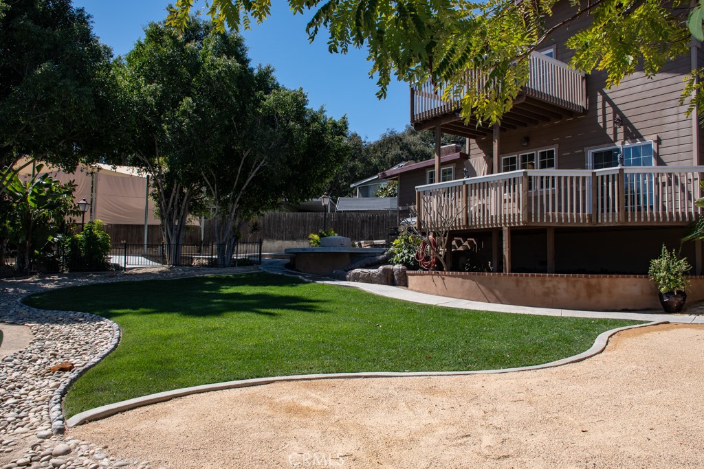 933 Eastside Road El Cajon, CA 92020 - Photo 31 of 70 a view of a house with a yard potted plants and a large tree