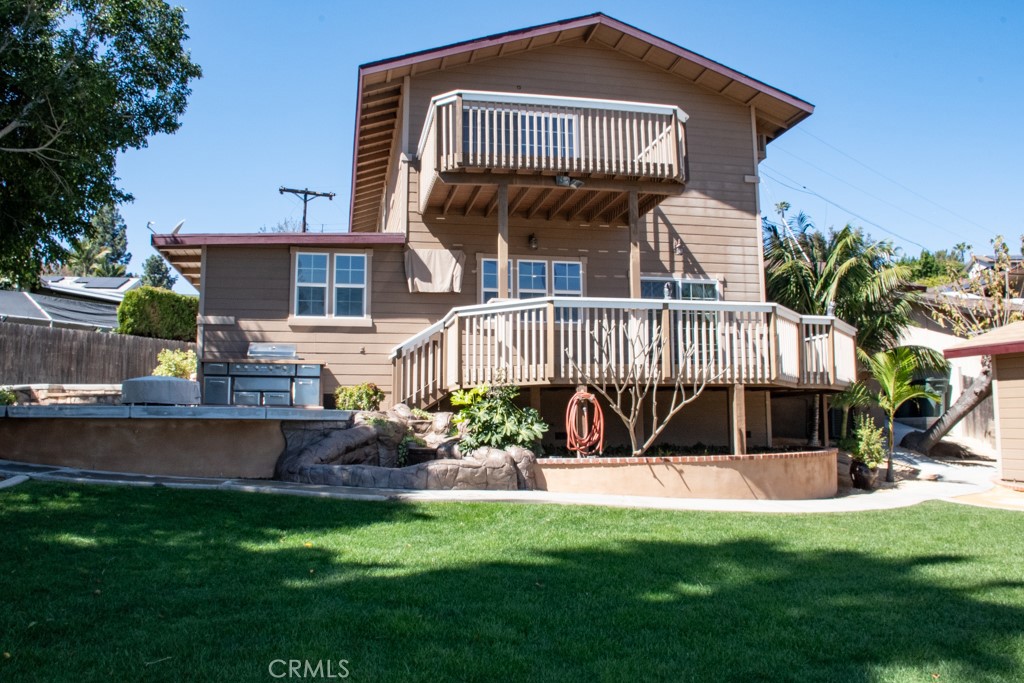 933 Eastside Road El Cajon, CA 92020 - Photo 35 of 70 a front view of a house with a yard table and chairs