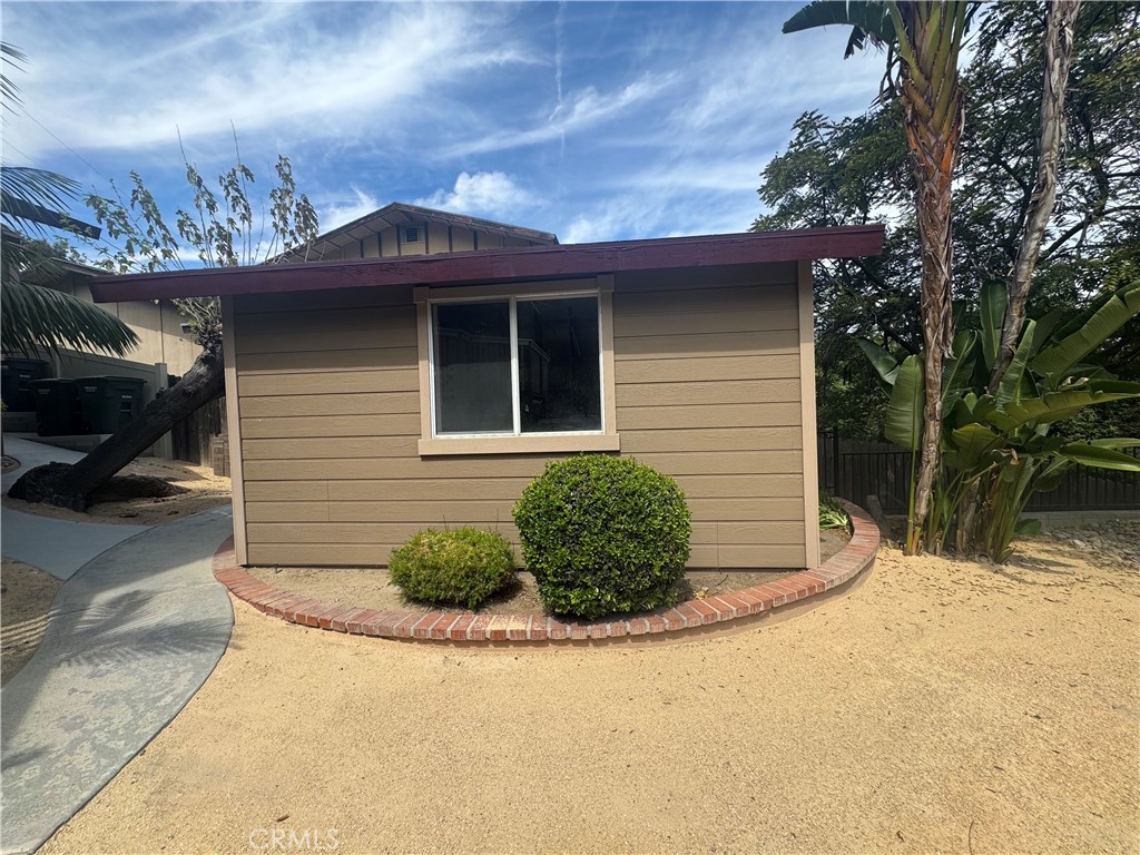 933 Eastside Road El Cajon, CA 92020 - Photo 44 of 70 a front view of a house with a yard and garage