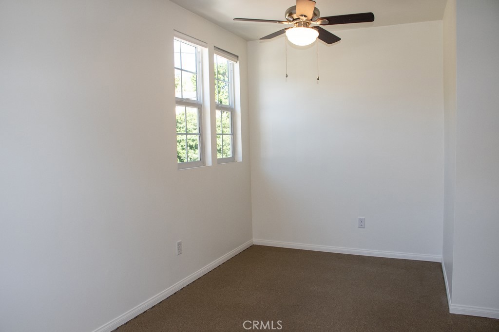 933 Eastside Road El Cajon, CA 92020 - Photo 49 of 70 an empty room with a window and a fan