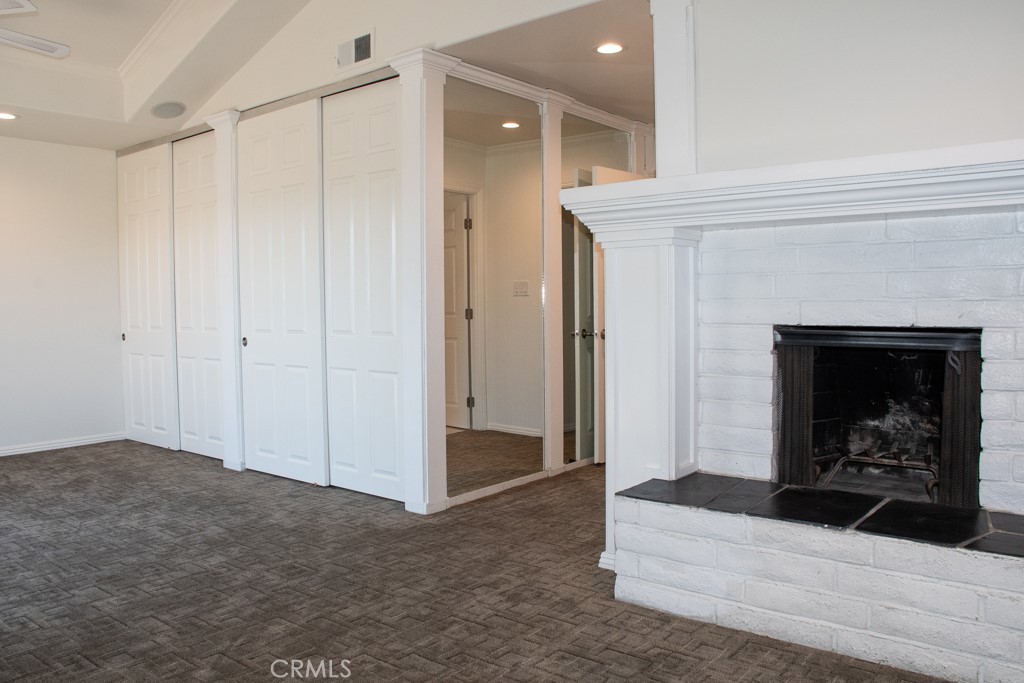 933 Eastside Road El Cajon, CA 92020 - Photo 60 of 70 a living room with a fireplace and a ceiling fan