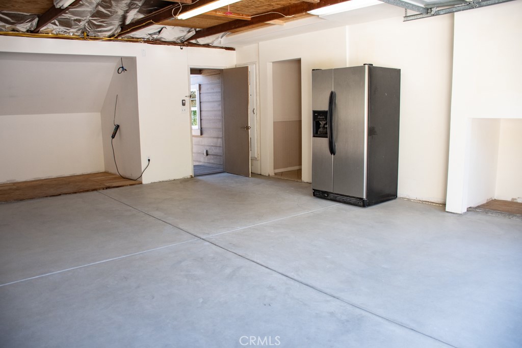 933 Eastside Road El Cajon, CA 92020 - Photo 70 of 70 a view of a refrigerator in kitchen and an empty room