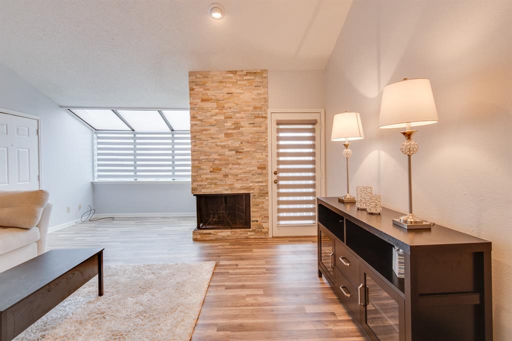 2100 Randy Snow Road, Unit 412 Arlington, TX 76011 - Photo 27 of 32 a living room with furniture and a fireplace