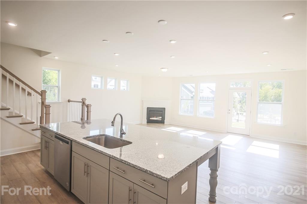 3005 Patchwork Court Fort Mill, SC 29708 - Photo 17 of 38 a kitchen with stainless steel appliances granite countertop a sink a stove and a refrigerator