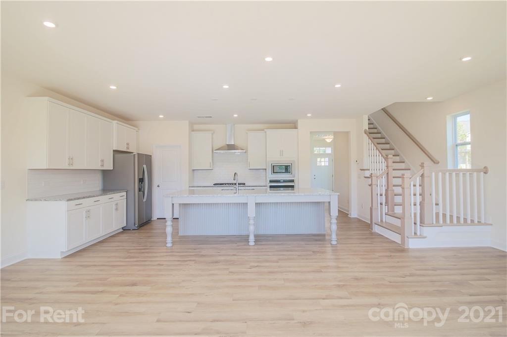 3005 Patchwork Court Fort Mill, SC 29708 - Photo 18 of 38 a large kitchen with stainless steel appliances kitchen island granite countertop a large cabinets a sink and a stove
