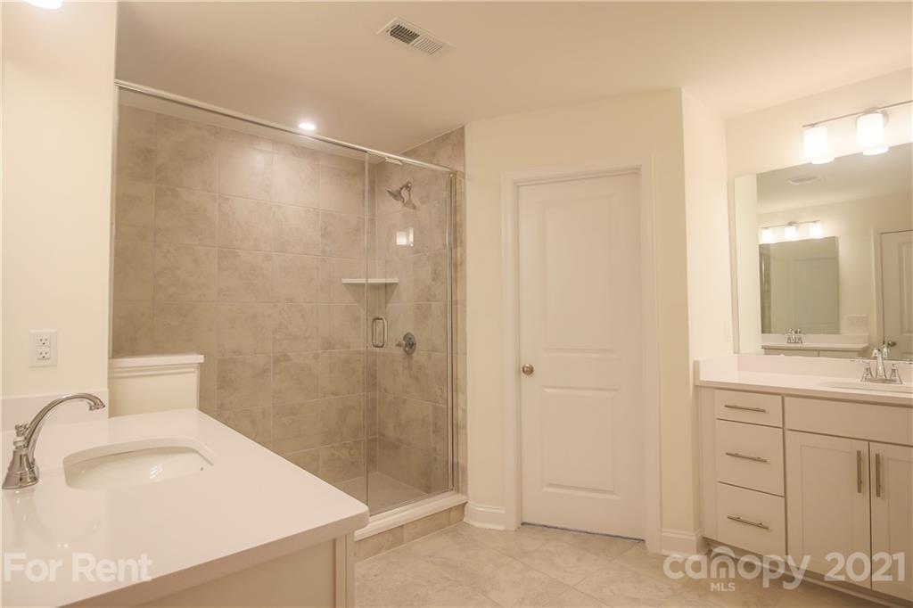 3005 Patchwork Court Fort Mill, SC 29708 - Photo 24 of 38 a bathroom with a sink and a mirror