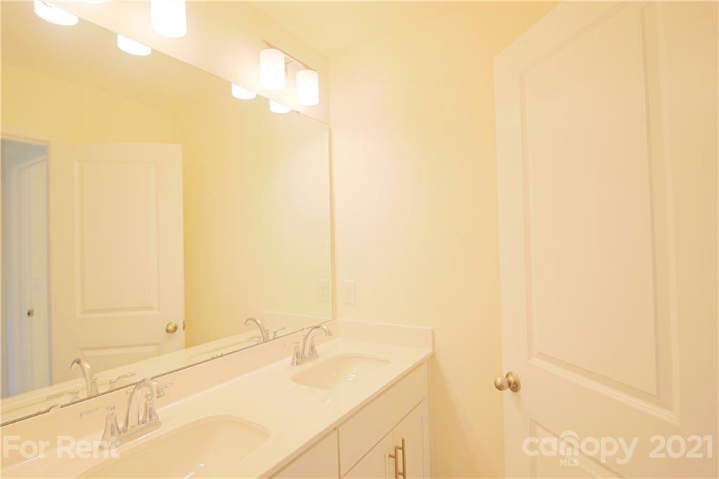 3005 Patchwork Court Fort Mill, SC 29708 - Photo 32 of 38 a bathroom with a tub and a sink