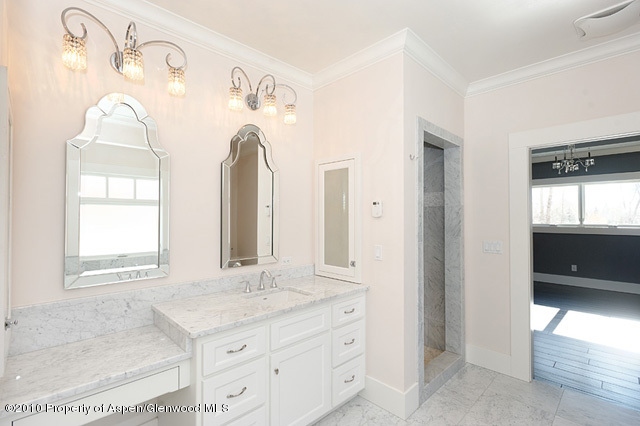 277 Willits Lane Basalt, CO 81621 - Photo 14 of 22 a bathroom with a granite countertop sink and a mirror