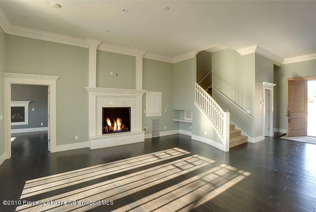 277 Willits Lane Basalt, CO 81621 - Photo 8 of 22 a living room with wooden floor and a fireplace