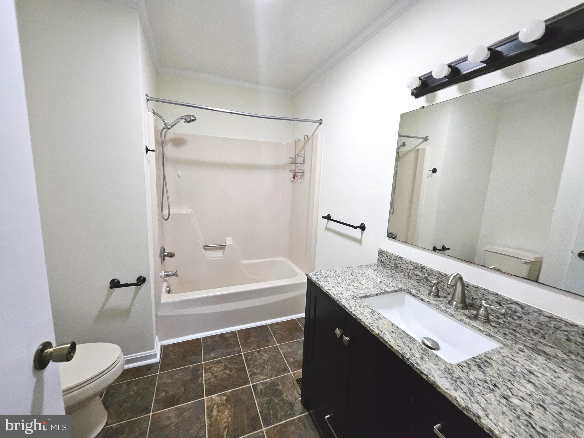 873 Skeeter Neck Road Frederica, DE 19946 - Photo 13 of 34 a bathroom with a granite countertop sink toilet and shower